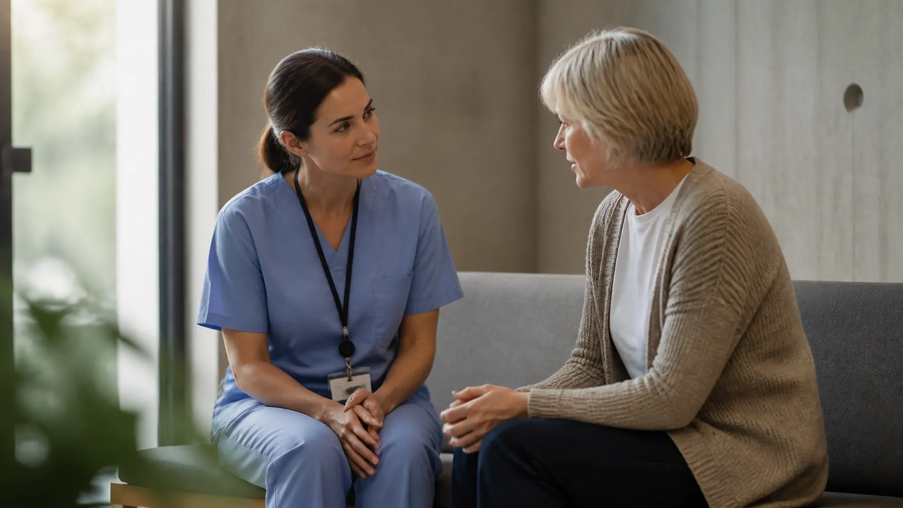 Two professionals listening closely to one another in conversation